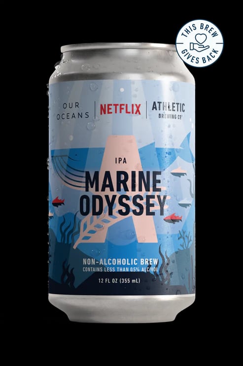 Marine Odyssey non-alcoholic beer showcasing bright citrus and lemongrass notes with a slightly hazy, rich golden hue reflecting the ocean's vitality