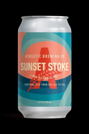 Sunset Stoke IPA by Athletic Brewing featuring a vibrant amber hue and notes of citrus and pine in a non-alcoholic beer
