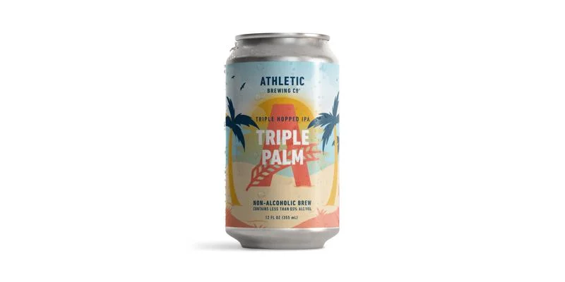 Triple Palm by Athletic Brewing Company, a non-alcoholic triple-hopped IPA with tropical mango, guava, and citrus notes on a plain background
