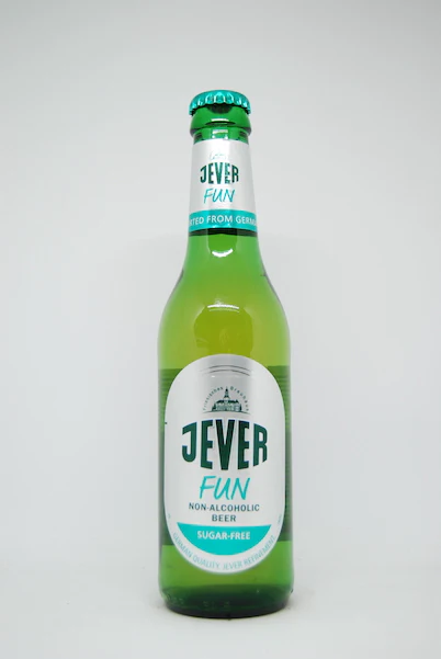 Jever Fun non-alcoholic beer showcasing crisp and refreshing pilsner character with zero sugar and low calories in a plain background