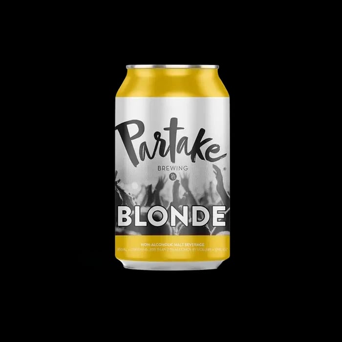 Product image of Partake Brewing Blonde Ale alcohol-free beer with a smooth malt-forward flavor and warm golden hue on plain background