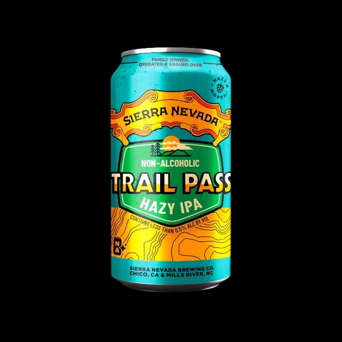 Trail Pass Hazy IPA, a non-alcoholic beer with a hazy appearance and appealing packaging, featuring Mosaic and El Dorado hops for a balanced flavor.