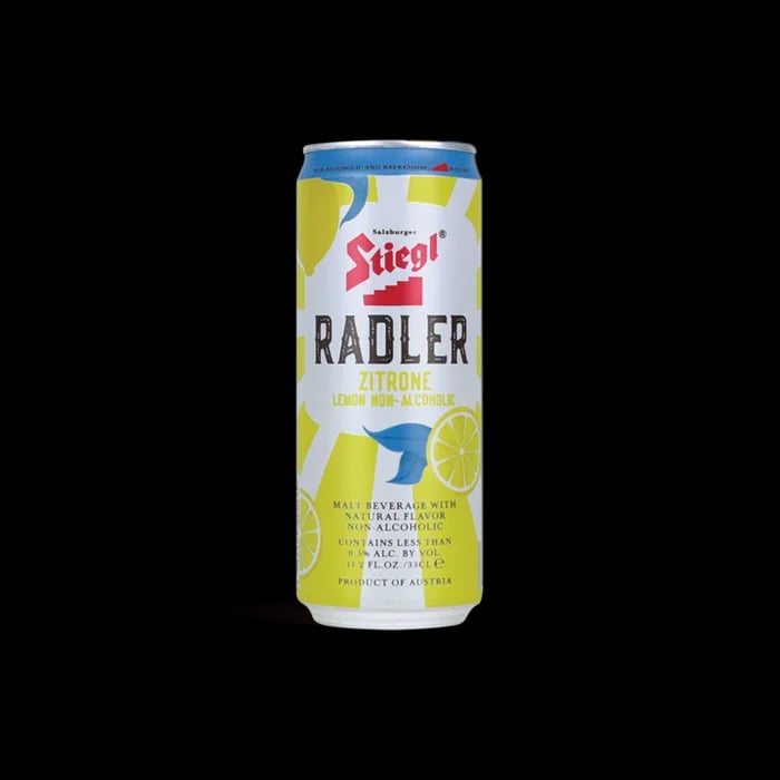 Stiegl Lemon Radler 0.0% non-alcoholic beer with natural lemon juice and refreshing citrus flavor against a plain background