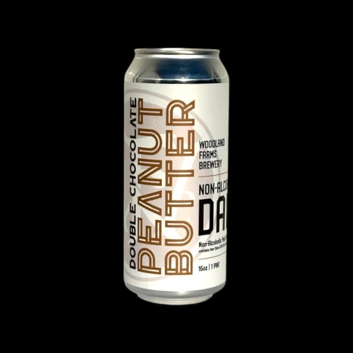 Woodland Farms Double Chocolate Peanut Butter Dark non-alcoholic beer showcasing rich chocolate malt and peanut butter flavors in a dark stout style